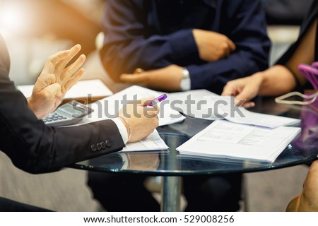 sales manager giving advice to his couple clients Royalty-Free Stock Photo #529008256