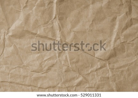 Old crumpled brown paper texture background