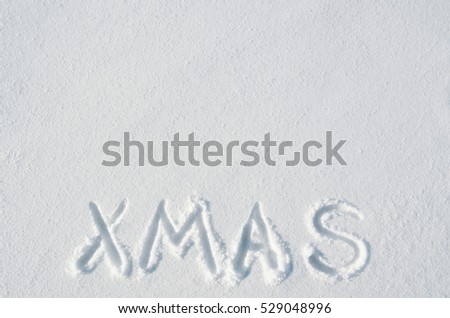 Xmas letters handdrawn on flat snow surface. Nice horizontal holiday postcard, greeting card template. Empty space for copy, text, lettering.