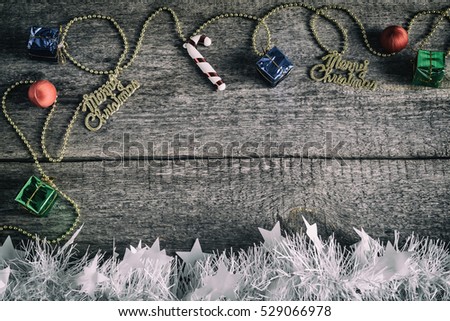 Christmas gift boxes, Christmas toys on an old wooden surface, top view, texture, space text, retro style