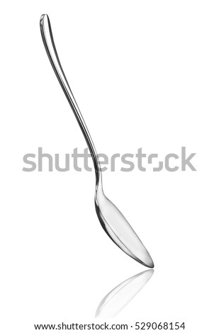 Silver spoon isolated on white background Royalty-Free Stock Photo #529068154