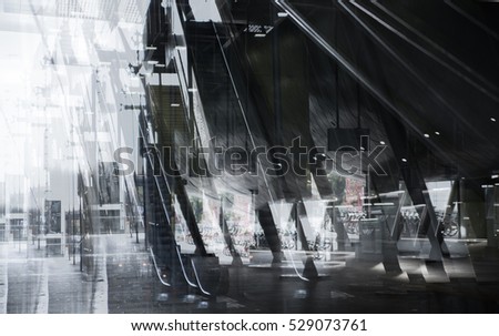 Modern architecture, Train station with escalators, supportive metal beams, tickets machine. Multiple exposure image 