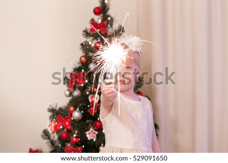 A girl holds a Sparkler