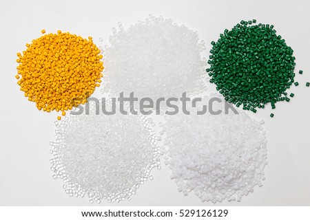 Polymeric dye. Plastic pellets. Colorant for plastics. Pigment in the granules.  Polymer beads Royalty-Free Stock Photo #529126129