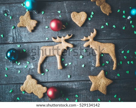 Cookies elk, heart, asterisk. Christmas card. Holidays background, selective focus and toned image
