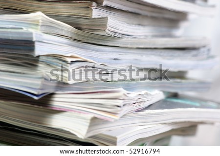 Stack of magazines . Close - up.