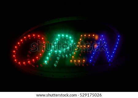 Glowing open sign in the dark