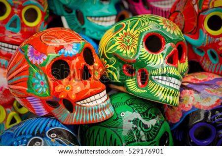 Decorated colorful skulls, ceramics death symbol at market, day of dead, Mexico Royalty-Free Stock Photo #529176901