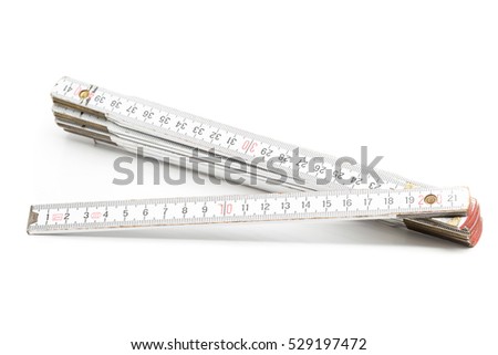 Folding rule with centimeter scale on white background Royalty-Free Stock Photo #529197472