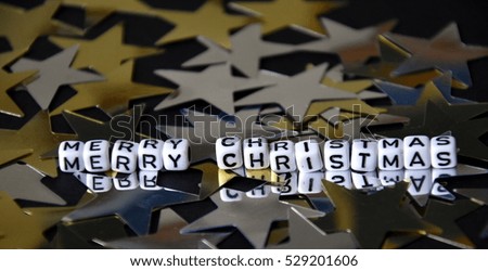 Happy new year on white cubes on golden silver stars background. New Year concept background. 