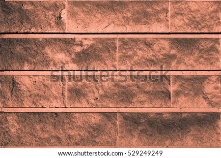 Perfect orange grayish orangish high resolution natural urban stone wall background. Close-up of a stylish deco wall backdrop, perfectly designed screen saver. Stone matter surface grid structure.