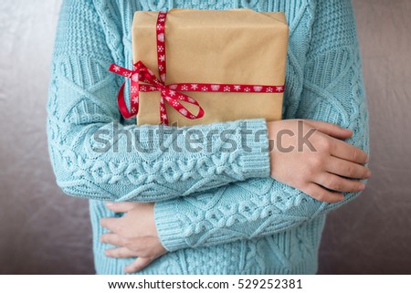 Christmas gifts. Merry christmas. Knitted mittens. Knitted dress. Box with gifts Present