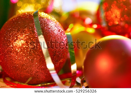 Red and gold christmas balls on decorative background