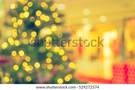 abstract blur image of shopping mall on christmas time for background . (vintage tone)