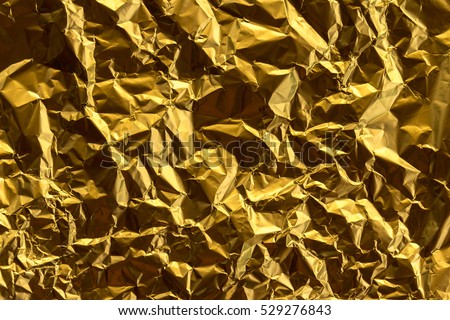 Crumpled gold foil texture background