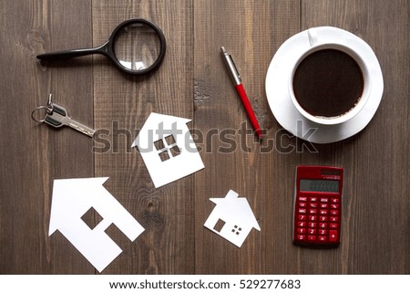concept of buying house on wooden background top view