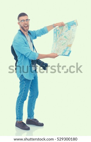 Handsome tourist looking at map isolated on white background