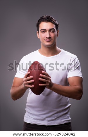 Man with american football in sports concept