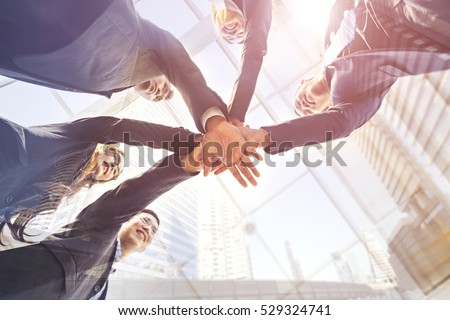 Asian business teamwork help together, team success on business integrity corporate partnership. Build work meeting friendship, trusting partnership relationship unity & strong community connection.  Royalty-Free Stock Photo #529324741