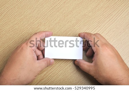 Hand hold blank mockup business card for branding and logo printing.