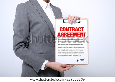 woman showing a written contract agreement