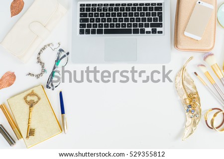 Modern laptop keyboard with golden woman accessories mock up flat lay styled scene, top view, copy space on white table background
