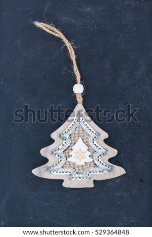 Decorative handmade christmas tree on black wooden background