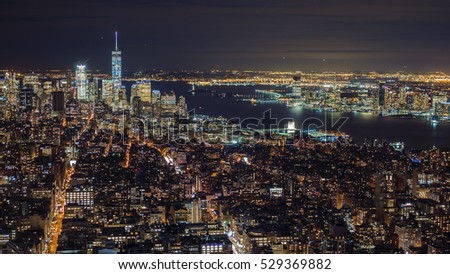 Manhattan aerial panorama cityscape skyline.  Far ahead of the Statue of Liberty can be seen. New York City, USA