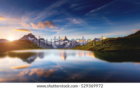 Panoramic view of the Mt. Schreckhorn and Wetterhorn. Popular tourist attraction. Dramatic and picturesque scene. Location place Bachalpsee in Swiss alps, Grindelwald valley, Europe. Beauty world.