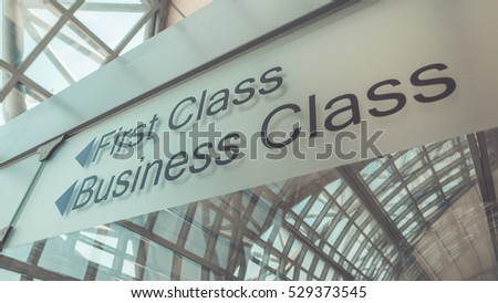 First Class and Business Class sign at the airport. (Vintage Style) Royalty-Free Stock Photo #529373545