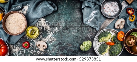 Rice and vegetables cooking ingredients, preparation on rustic background, top view, banner. Healthy vegetarian food or Diet concept.