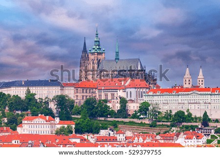 Panoramic view of St. Vitus Cathedral and Castle in Prague, Czech Republic. Beautiful dramatic picture in pink colors