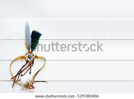 Dream Catcher Handmade Feather on White Wood Background