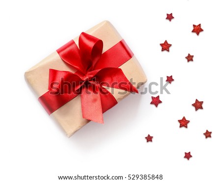 Gift box with red ribbon on white background. Christmas present. Royalty-Free Stock Photo #529385848