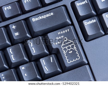 keyboard with printed image of Santa Claus inscription happy new year