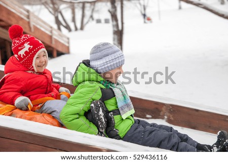 Winter portrait of kid boy in colorful clothes, outdoors
