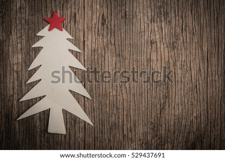 Handmade paper Christmas tree on rustic wood