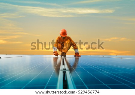 A man working at solar power station Royalty-Free Stock Photo #529456774