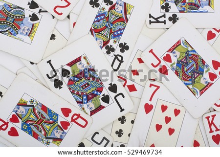 Poker card texture. Texas holdem lucky game. Real poker cards as background in studio photo. 
