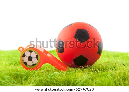 Dutch whistle and soccer ball in the playing fields