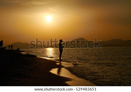 Tropical sunset and the shot on the beach