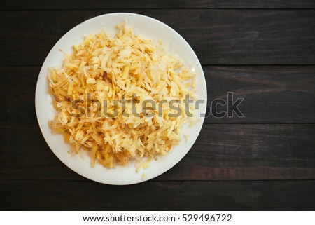 The raw grated potato on a plate Royalty-Free Stock Photo #529496722