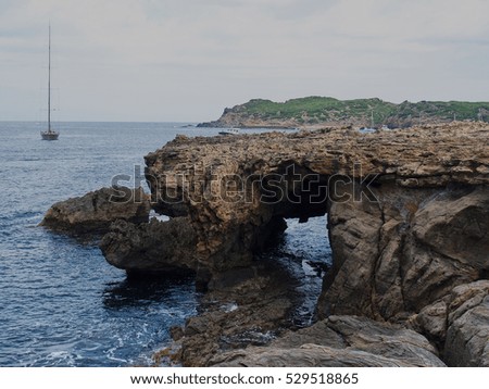 Area of coast with sailing ships and boats small