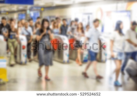 Abstract blur people transit in underground train entrance for background