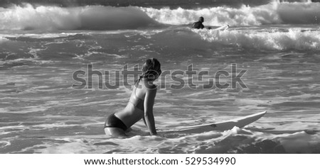 girl sit on the surf board