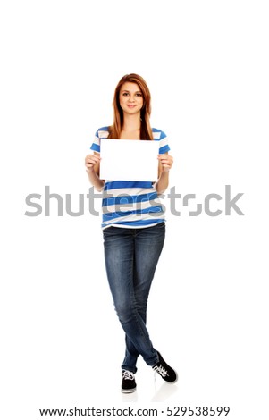 Teenage woman holding blank card 