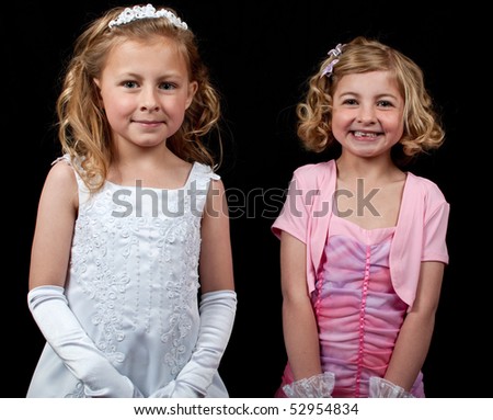 portrait picture of children on black backdrop