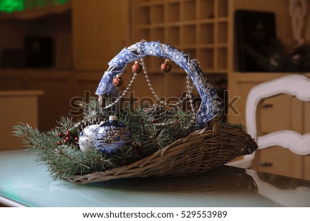 Merry Christmas and New Year decorations, balls, garlands, pine cone in the basket. Concept of holidays