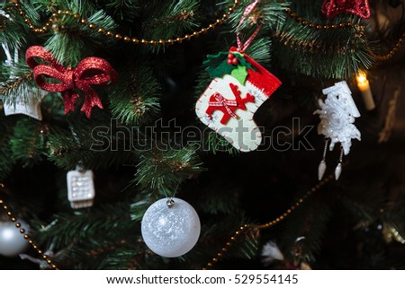 Beautiful toys and gifts on Christmas tree. Concept of Happy New Year