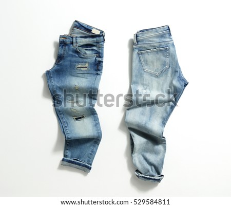 Blue Jeans Isolated on White Background. Royalty-Free Stock Photo #529584811
